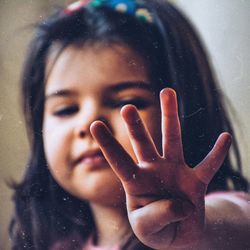 Close-up portrait of water drops on window