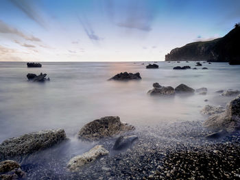 Scenic view of sea against sky at sunset