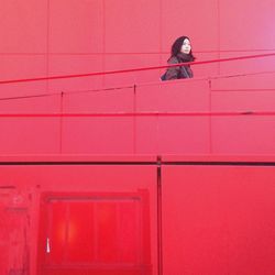 Woman on red stairway