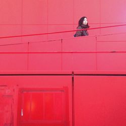 Red wall with closed door