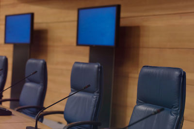 Computers on wall in conference room