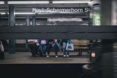 Group of people on railroad station platform