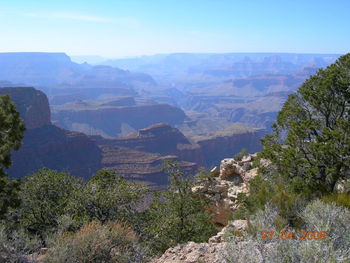 Scenic view of landscape and mountains against sky