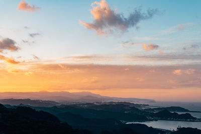 Scenic view of mountains against sky during sunset