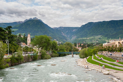 Panoramic view of trees and buildings against sky