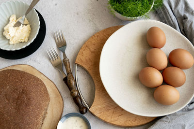 High angle view of eggs in plate on table