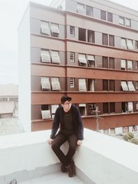 Man sitting on terrace in city