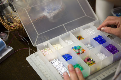 Cropped image of hand holding book