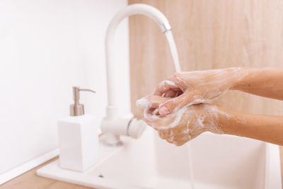 Cropped image of hands with soap sud