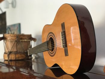 Close-up of guitar on table