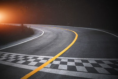 Empty road against blue sky