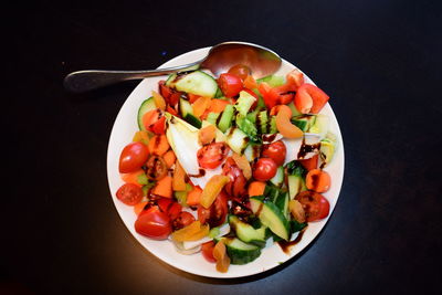 High angle view of chopped fruits in bowl on table