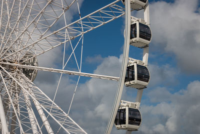 Low angle view of ferris wheel against sky