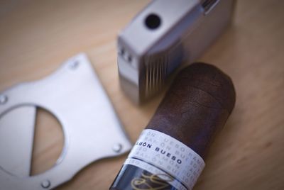 Close-up of cigar with cutter on table