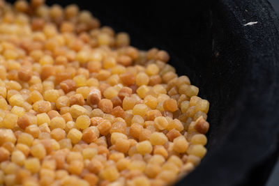 Close-up of fresh orange in container