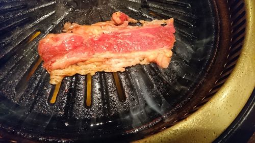 Close-up of meat on barbecue grill