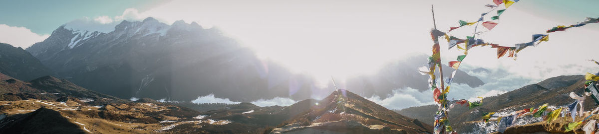 Panoramic view of snowcapped mountains against sky