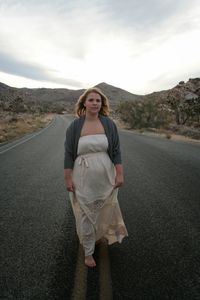 Portrait of woman walking on road at joshua tree national park