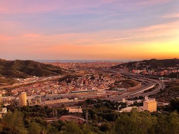 High angle view of city at sunset