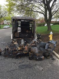 Abandoned truck on field in city