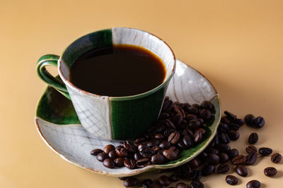 Close-up of coffee cup on table