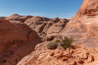 Full frame view of sandstone formations against a clear blue sky