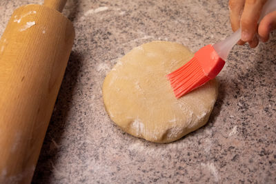 Midsection of person preparing food