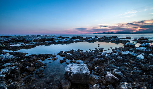 View of calm sea against scenic sky