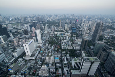 High angle view of modern buildings in city against sky