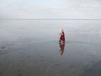 Woman standing on beach