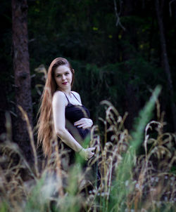 Portrait of woman in forest