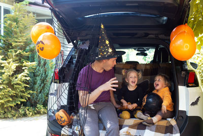 High angle view of people sitting in car