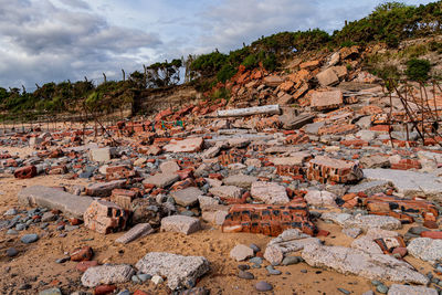 Signs of coastal erosion on a beach at powfoot dumfries and galloway in scotland