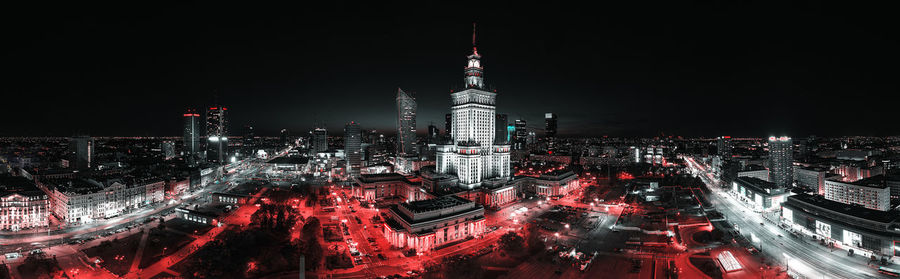 Aerial view of illuminated city buildings at night