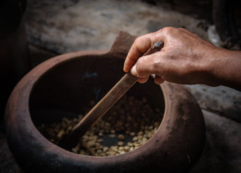 Cropped hand preparing food