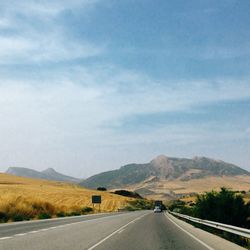 View of country road against sky