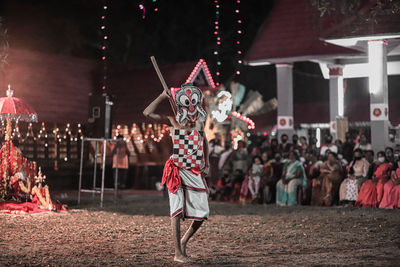 Group of people in traditional clothing during festival