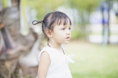 Portrait of young woman looking away