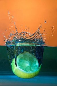 Close-up of water splashing against gray background