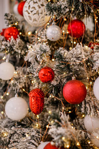 Close-up of christmas decorations hanging on tree