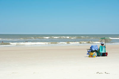 Scenic view of beach against clear sky