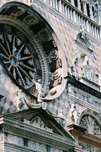 Low angle view of statues on old building
