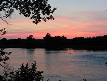 Scenic view of lake at sunset