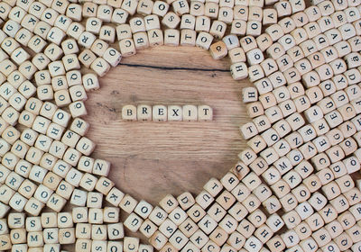 Directly above shot of text amidst wooden cubes