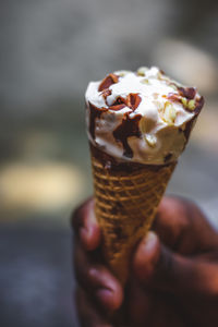 Cropped image of hand holding ice cream