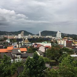 High angle view of buildings in city against sky