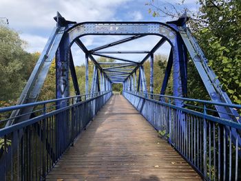 Bridge over footbridge against sky
