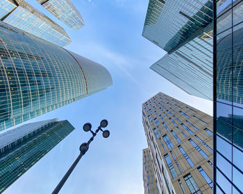 Low angle view of modern buildings against sky