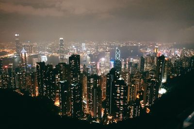 High angle view of illuminated buildings in city at night