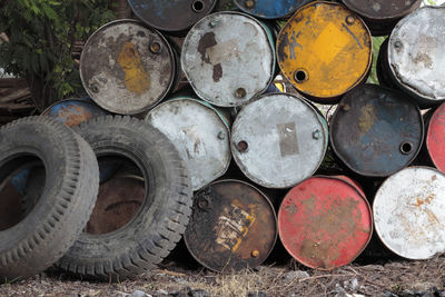 Tire against abandoned stacked containers